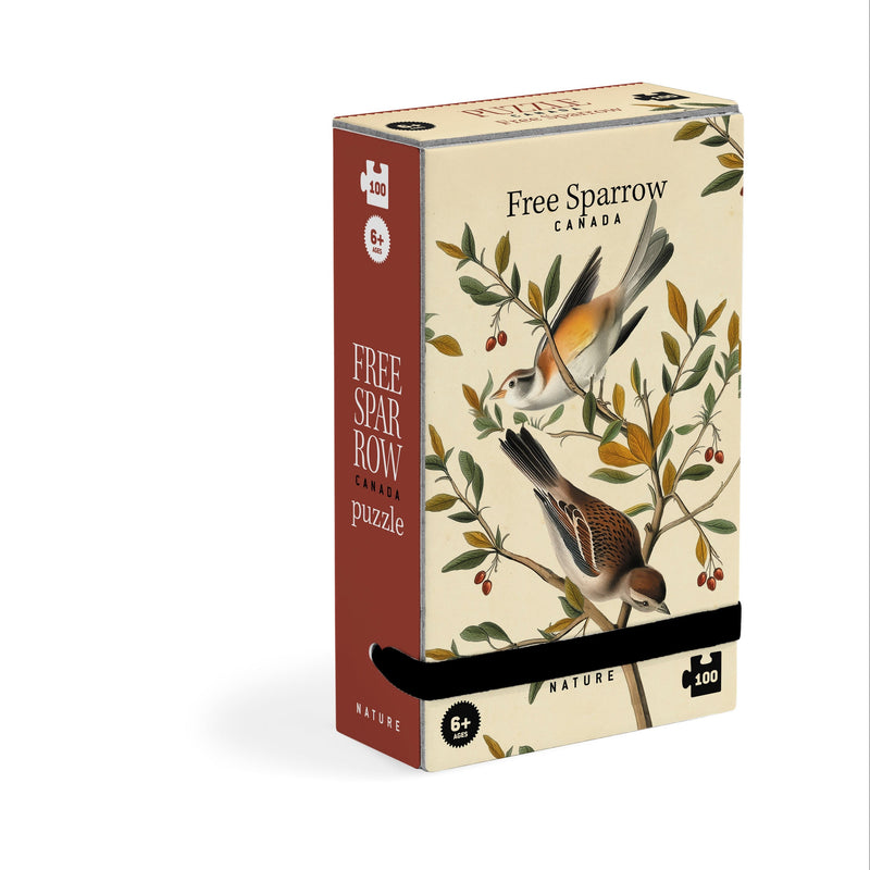Londji Free Sparrow tiny puzzle assembled beside its box
