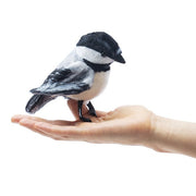 Folkmanis Mini Chickadee finger puppet worn on a hand